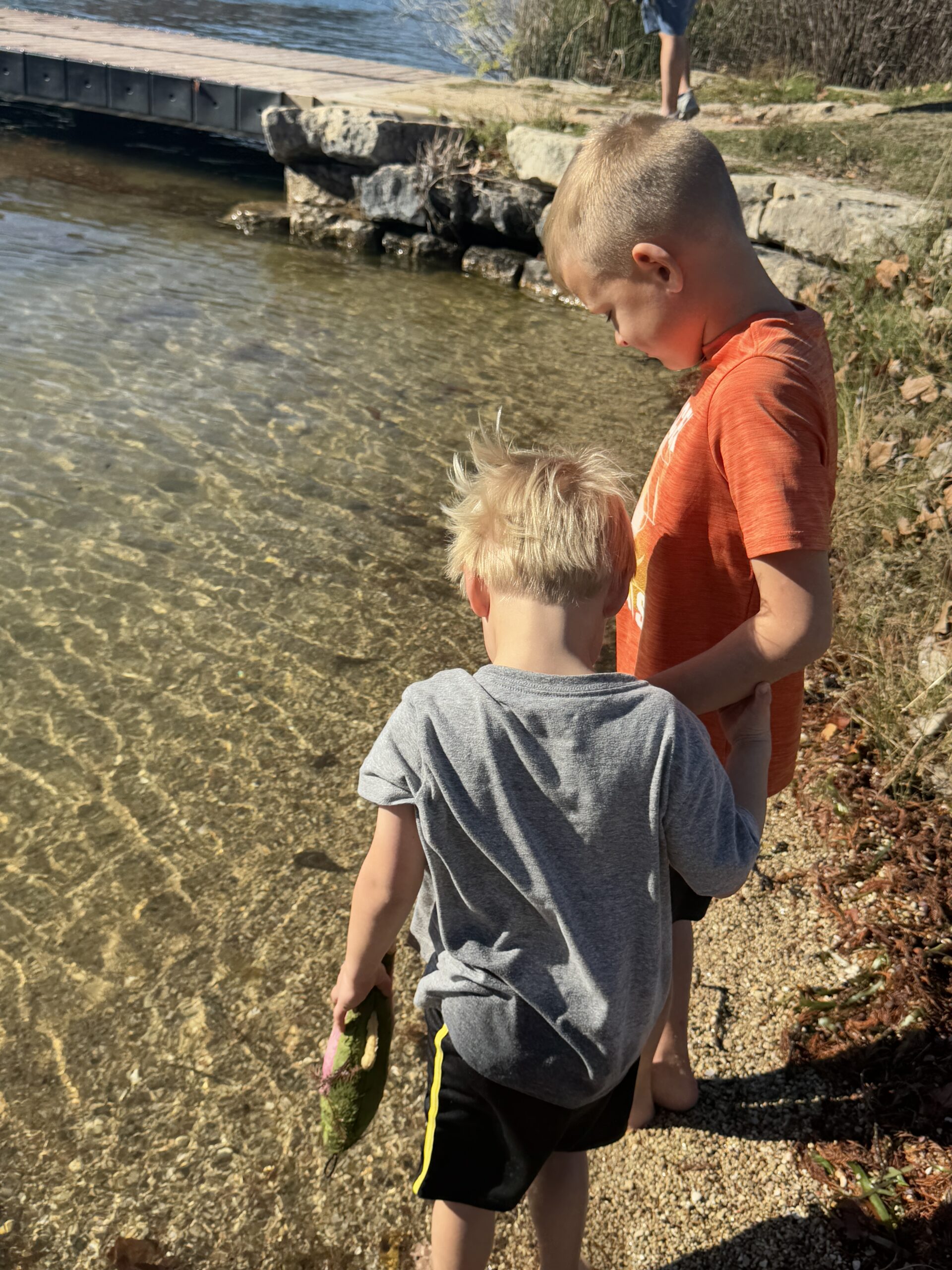 Kids playing in Shallow Lake Water