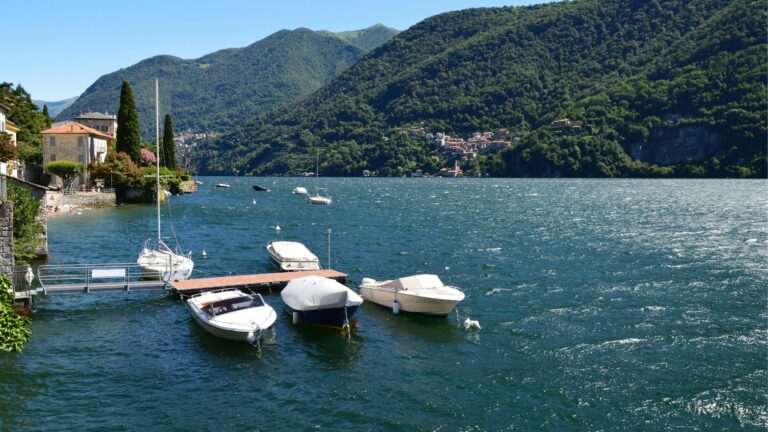 Lake with boats along a dock