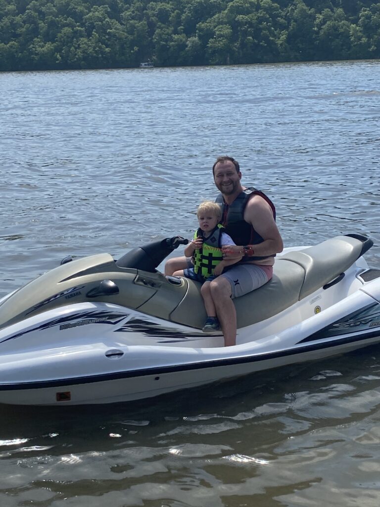 Dad and Son on a jet ski at the Lake