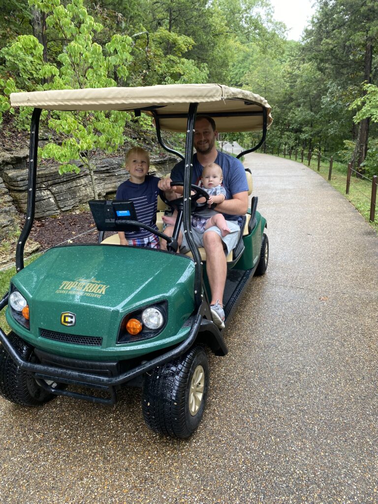 Dad with two sons in Golf cart at Top of the Rock Tour in Branson