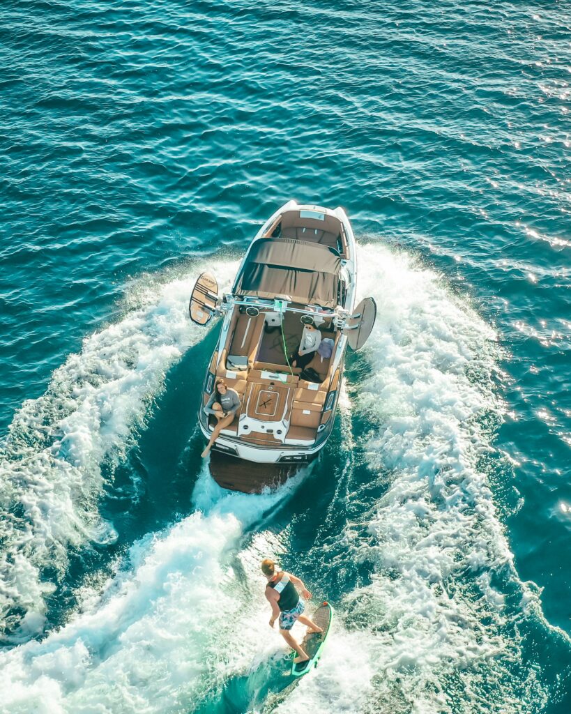 Wake Surfer behind a speedboat on Lake Okoboji