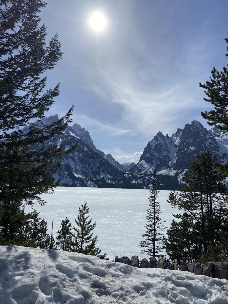 Breathtaking view of snowcapped mountains and frozen lake in Jackson, WY.