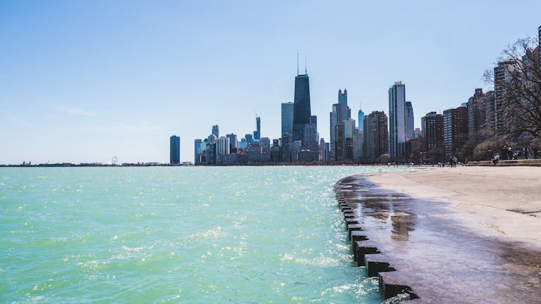 Panoramic view of the iconic Chicago skyline from the lakefront on a bright day.