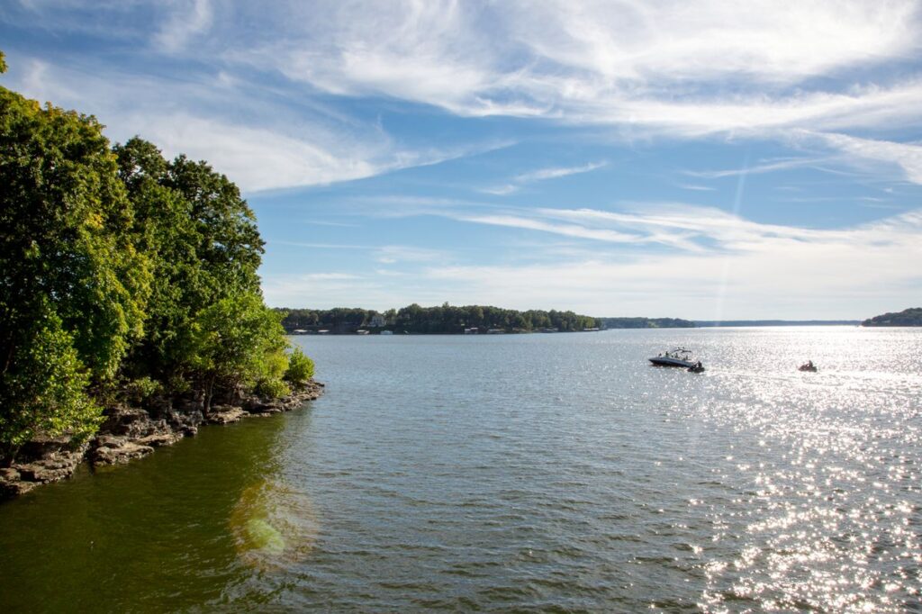 Grand Lake with Boat in the distance at sunset