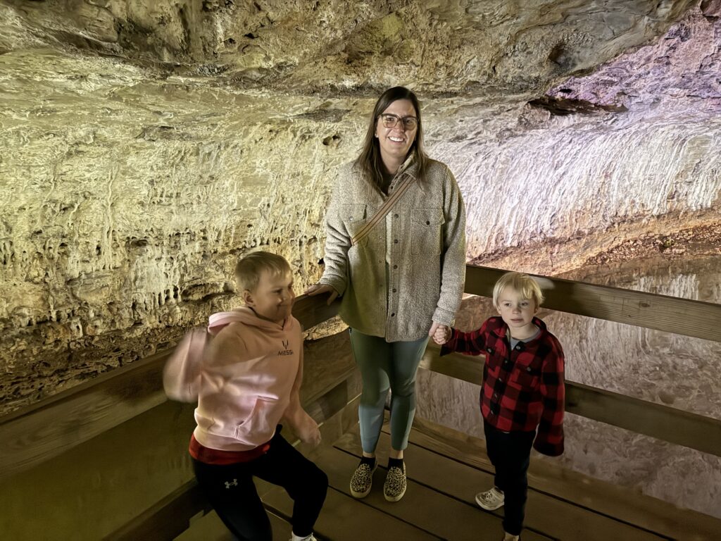 Mom with two young boys inside of Stark Caverns