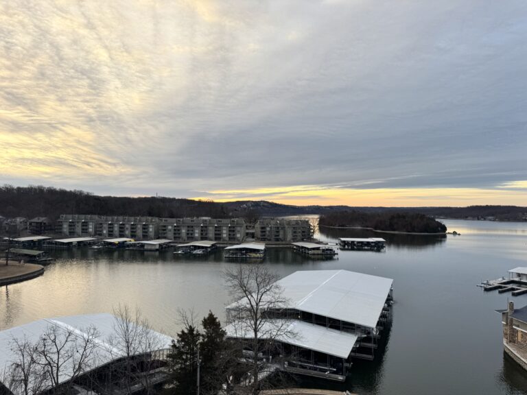 Lake of the Ozarks at sunrise with docks along the shore