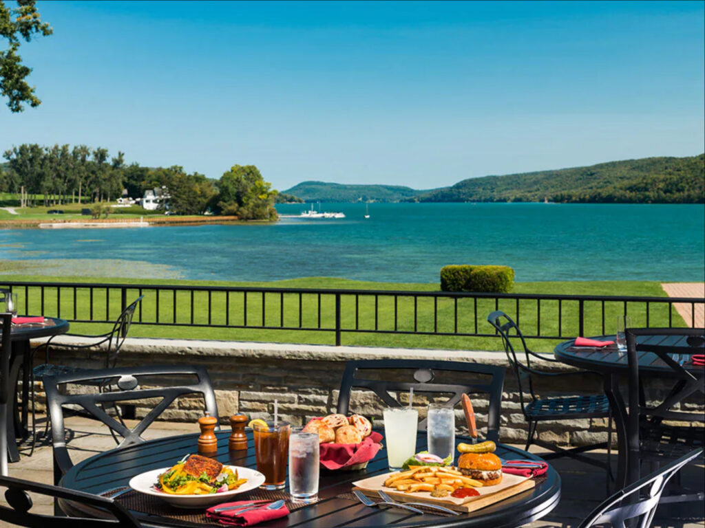 Hawkeye Bar & Grill at Otesaga Resort from patio overlooking the water