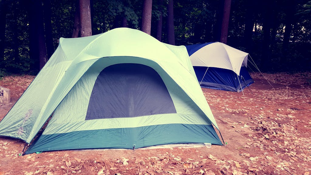 A scenic campsite featuring tents in a wooded area at Lake George, NY.