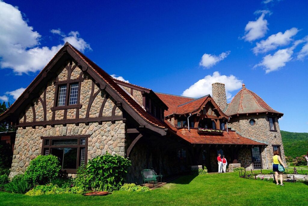 Castle in the Clouds with blue sky and green grass