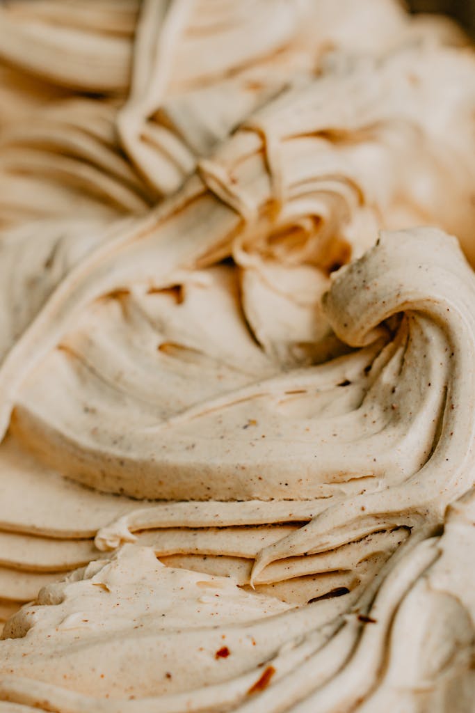 Close-up of a creamy, textured dessert showcasing swirled patterns.