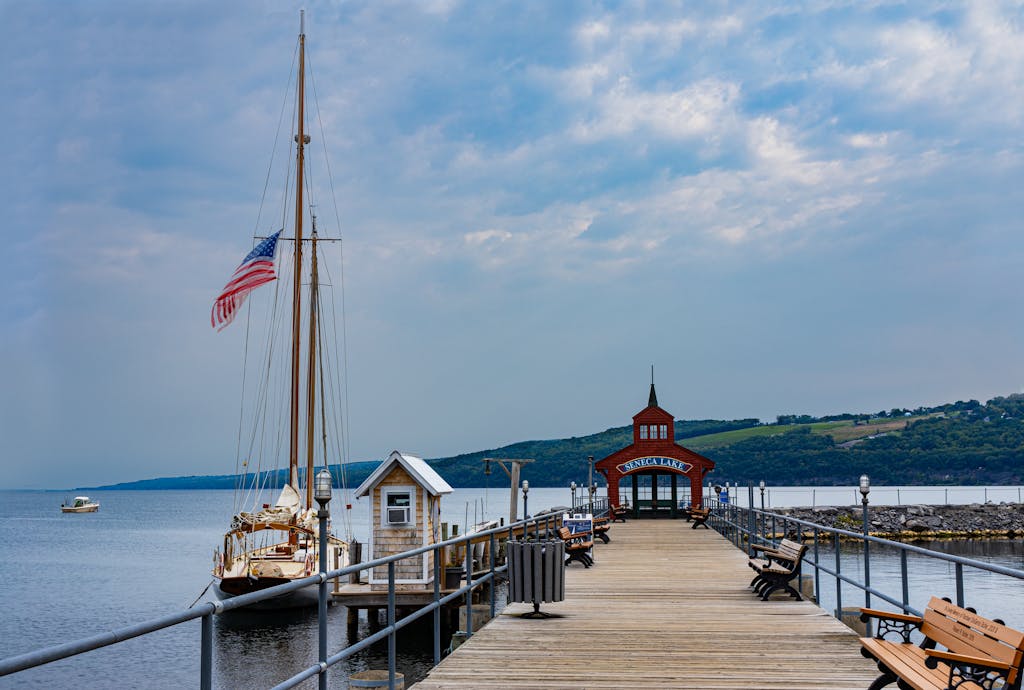 Explore the picturesque boardwalk at Seneca Lake with sailboats and stunning views in Watkins Glen, NY.