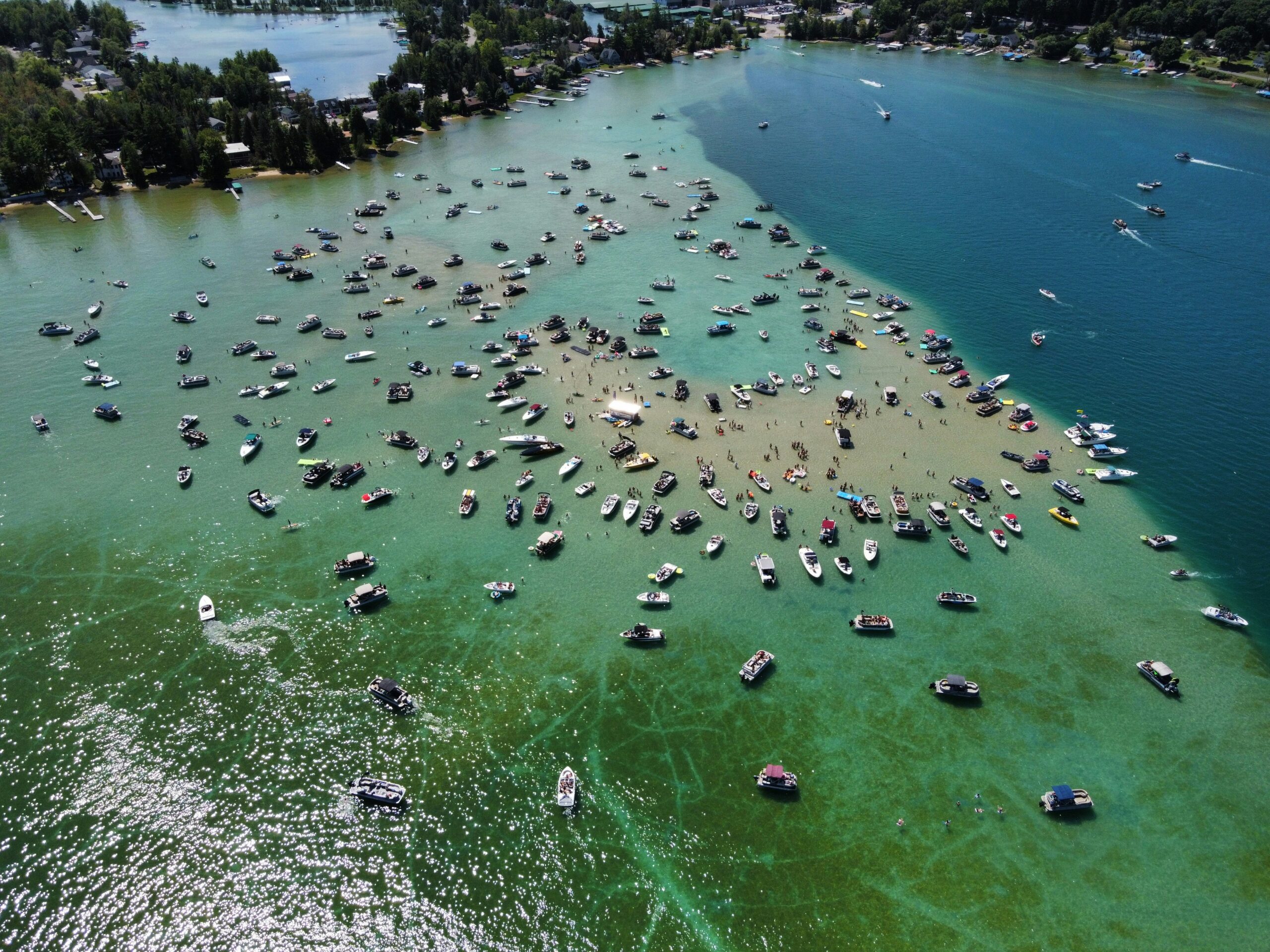 Torch Lake Aerial view of boats hanging out at the sandbar