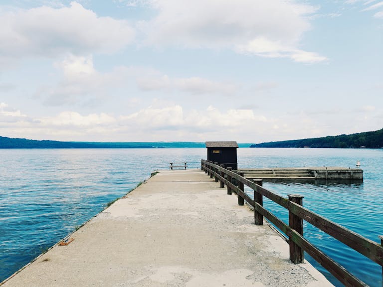 Peaceful view of a pier on Canandaigua Lake, perfect for serene moments.