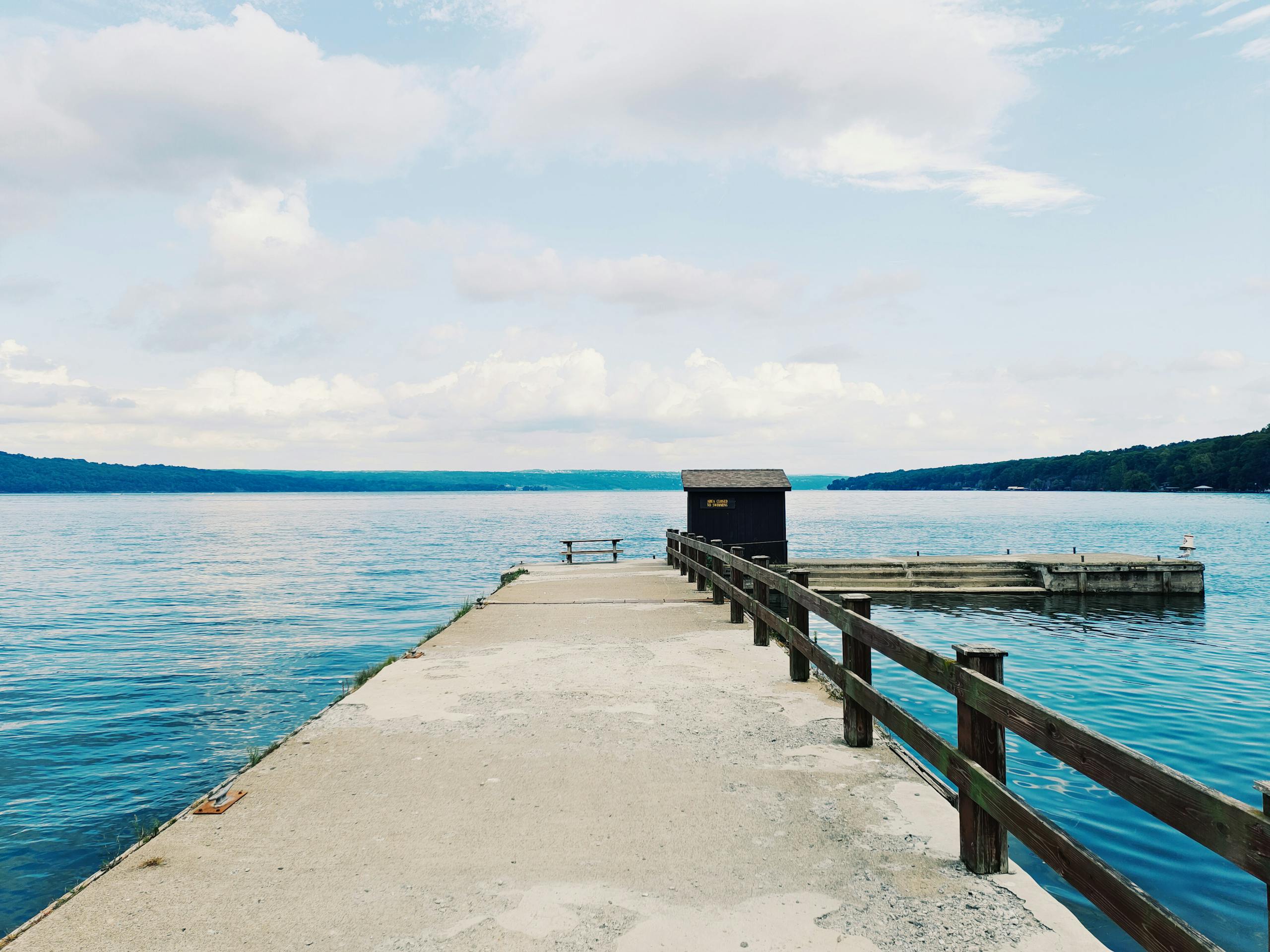 Peaceful view of a pier on Canandaigua Lake, perfect for serene moments.