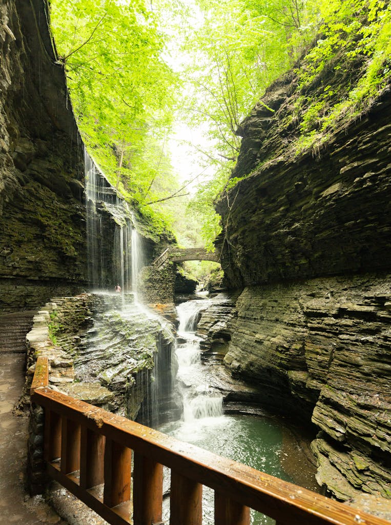 Scenic view of waterfalls amidst rock formations at Watkins Glen State Park, NY.